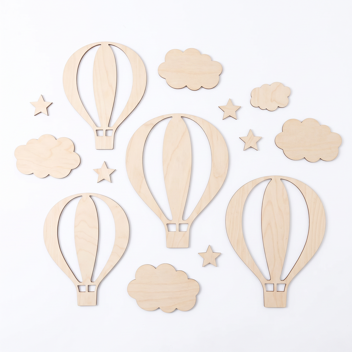 Wooden hot air balloon, cloud and star wall decor set laid out on a white background