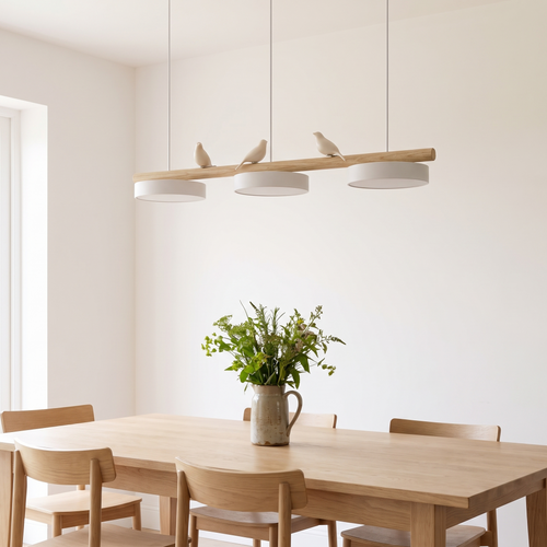 Birdsong linear pendant hanging above an oak dining table in a family kitchen diner