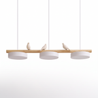 Birdsong resin bird linear pendant light with three disc shades on a white background