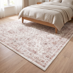 Savona rug laid at the foot of an oak bed in a neutral bedroom